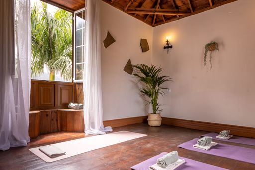A modern interior of a room with yoga mats
