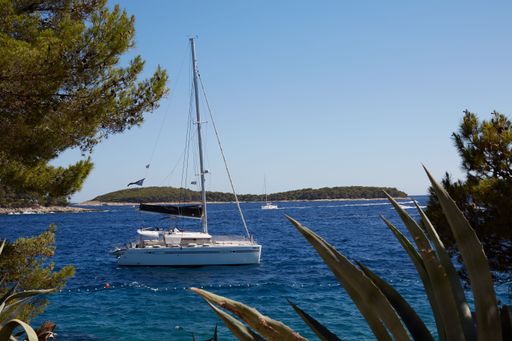 A scenic shot of catamaran boats on the Adriatic Sea on the coast of Hvar Island in Dalmatia, Croatia