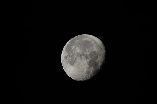 A closeup of a waning gibbous moon with its visible craters