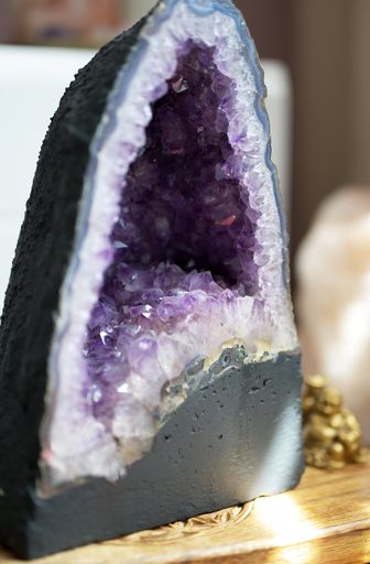 A vertical shot of amethyst geode on a table