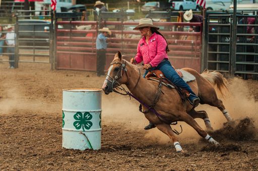 A cowgirl barrel racing at the Wyandotte County Kansas Fair Rodeo