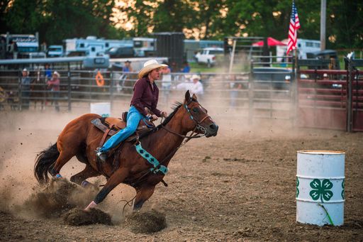 A cowgirl barrel racing at the Wyandotte County Kansas Fair Rodeo