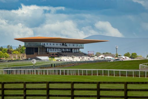 Beautiful view of one of the most important Curragh racecourse under blue sky with fluffy clouds, Newbridge, Ireland