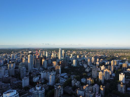 The cityscape of Vancouver against the background of the blue sky. British Columbia, Canada.
