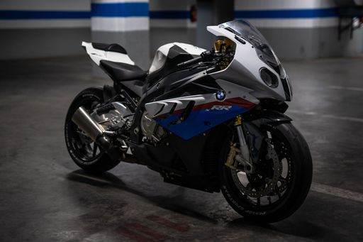 A new BMW motorbike in a parking lot.