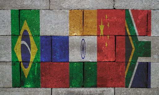 A graffiti of South African, Chinese, Indian, Russian and Brazilian flags painted on stone wall