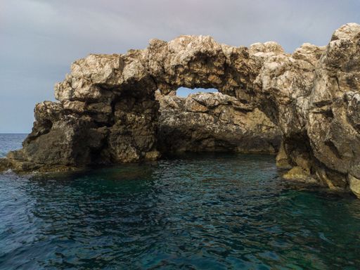 A beautiful water cave in the blue sea at Tremiti Islands in Apulia