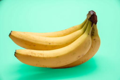 A fresh ripe banana isolated on a blue background