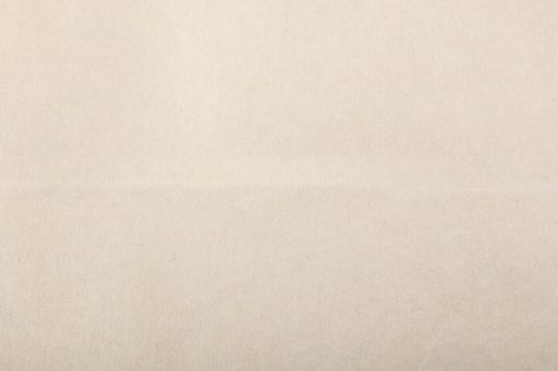 A plain white textured paper with copy space for text