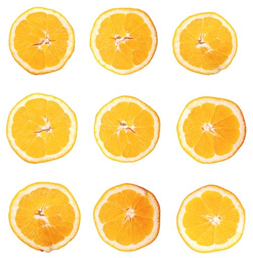 A top view of fresh orange slices isolated on white background