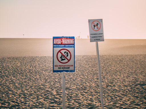 A closeup shot of prohibition signs in Foz do Arelho beach