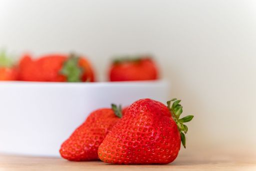 A selective focus shot of strawberries on a white background