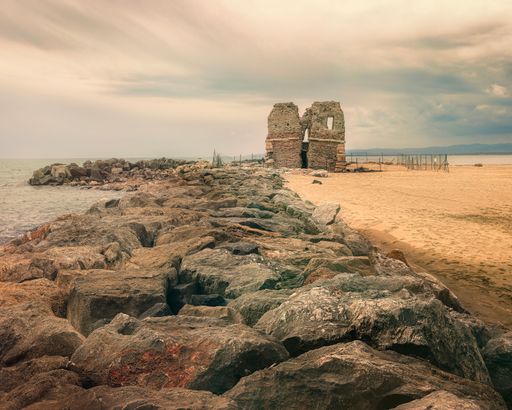 Beautiful scenery with Italian medieval ruined tower on peaceful seashore