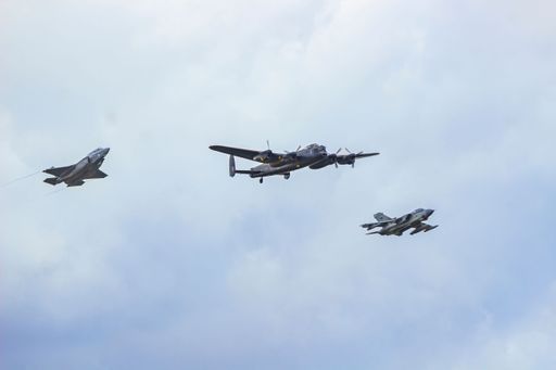 An Avro Lancaster, A Panavia Tornado and a F35 Lightning II fly over the Imperial War Museum of Duxford