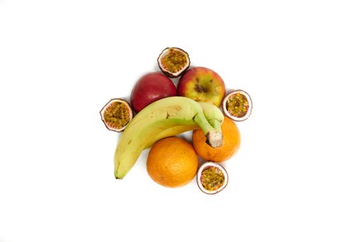 A top view of different fruits on a white isolated background