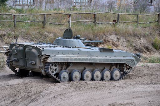 A Panzer BMP 1 Sowjetisch DDR driving to the muddy road