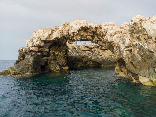A beautiful shot of stone formations over the water at the Tremiti Islands in Puglia, Italy
