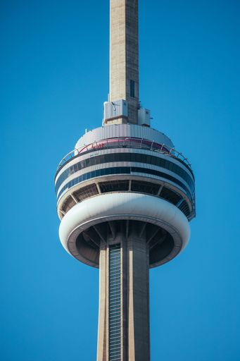 A vertical shot of the top of CN tower against cloudless sky in Toronto, Canada