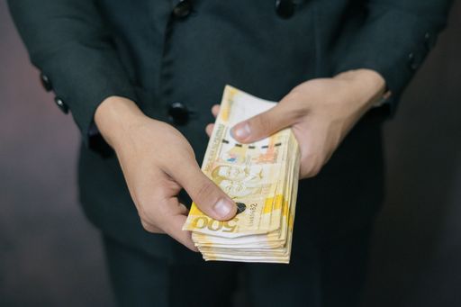Close-up Shot of a Successful Business Man Counting a lot of Philippine Banknotes Money. Success in Business Finance Economy Currency over Success