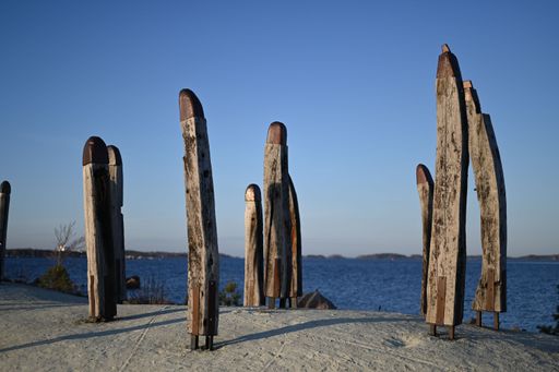 The historic mystic poles standing on the rocks near the Baltic Sea