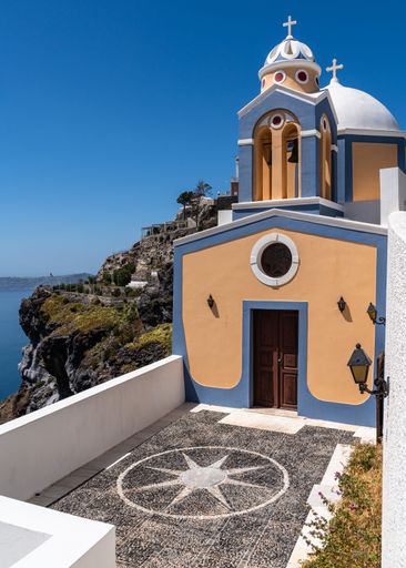 A picturesque church in Fira overlooking the Aegean Sea, Santorini, Greece