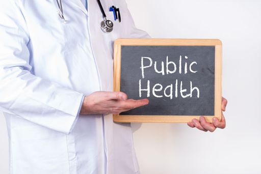 Doctor points to a board that says Public Health