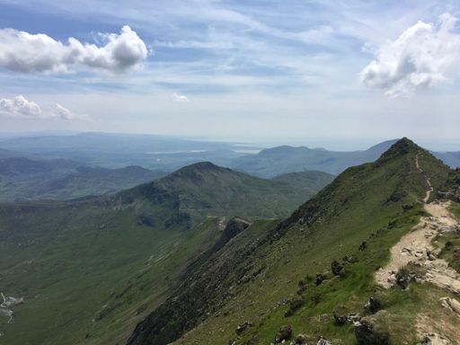 A scenic view of the green mountain ranges of Snwodonia national park of Wales, UK