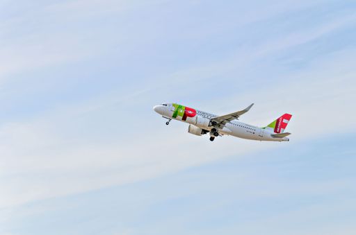 A beautiful shot of Tap Air Portugal Airbus A320 plane landing at El Prat airport in Barcelona Spain