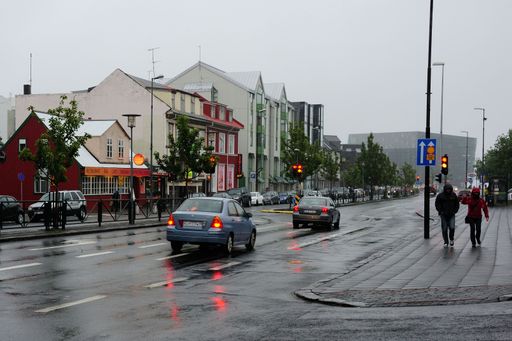 Two cars driving on a rainy day in the streets of Reykjavik, Iceland
