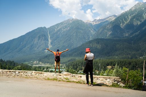 Hiking in the mountains and taking photos in Betaab Valley Pahalgam, Jammu and Kashmir, India.