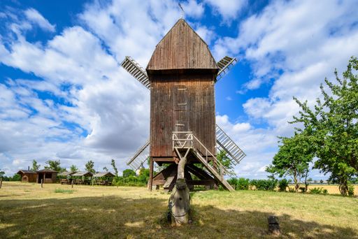A view of a beautiful windmill in Germany in a natural setting and an eye catcher for tourists