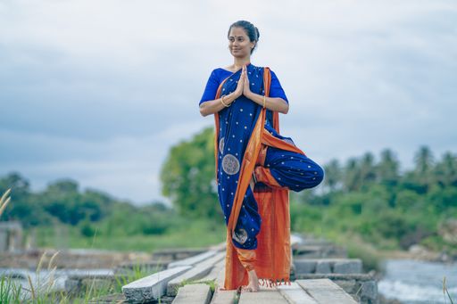 A yogini doing Asana in an ancient temple