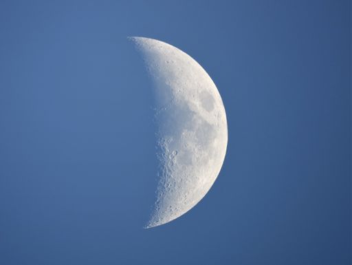 Daytime Moon 39%, Waxing crescent : taken with an 8" Newtonian telescope and a Canon dslr. The Moon in daytime in a blue sky has something beautiful.