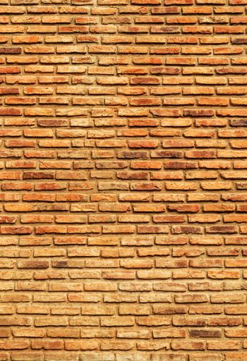 Seamless texture of weathered wall finish beige decorative brick. Stone Wall Pattern.