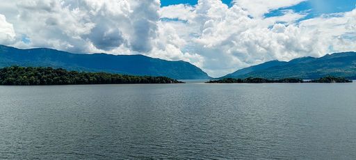 A panorama view of a beautiful lake near the mountains
