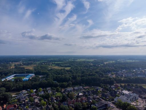An aerial shot of a suburban town on a cloudy day