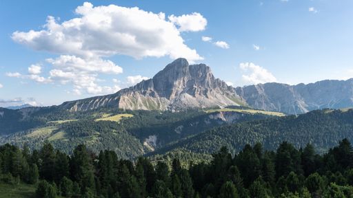 An aerial panoramic shot of the rocky mountains in Dolomites, Italy