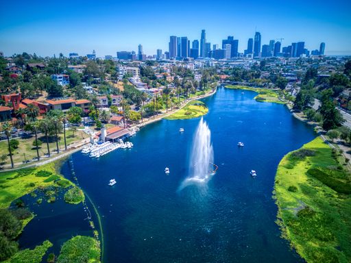 An aerial view of Echo Park Lake near the skyline of downtown Los Angeles