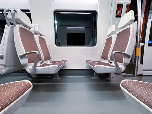 The empty seats in a modern train
