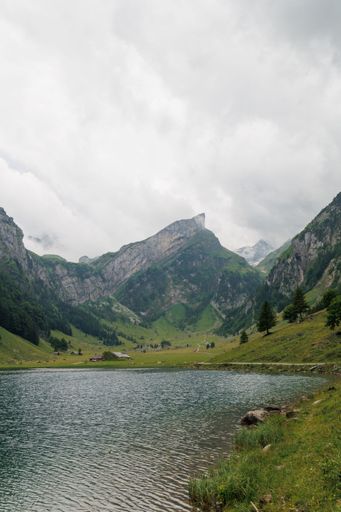 A vertical shot of the Seealpsee, a lake in the Alpstein range, Switzerland
