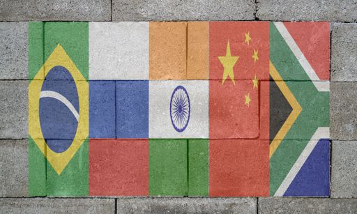 A closeup of a wall with BRICS flags