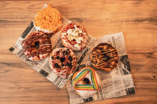 A selective focus shot of a set of various delicious and appetizing donuts