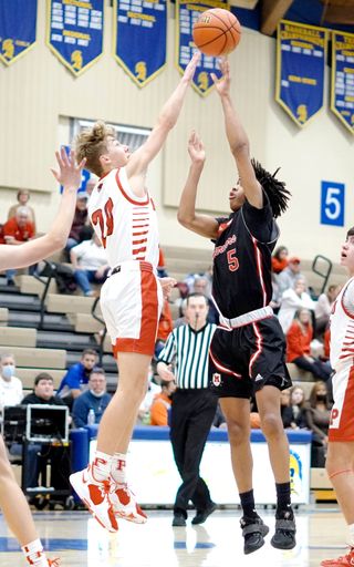 The basketball athletes during the Portage vs Hammond match competition  between the Morton  and Indiana High School basketball teams, vertical