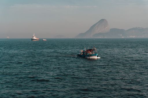 Beautiful landscape shot of the bay in Rio de Janeiro with boats and the mountains.