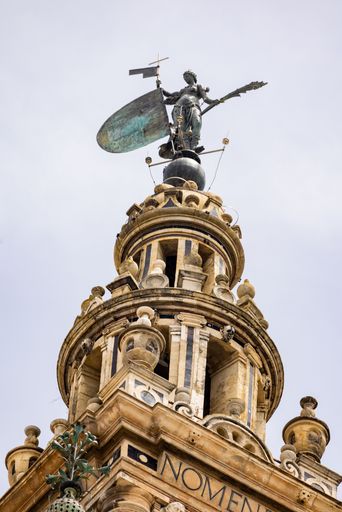 A vertical low angle shot of Girardillo, renascentist statue on top of the Giralda tower on the cathedral of Seville, Spain