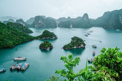 An aerial shot of Ha Long Bay, Vietnam with boats on water surface