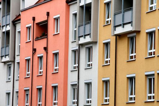 The multistory and residential building in Bilbao, Spain with windows and brick walls