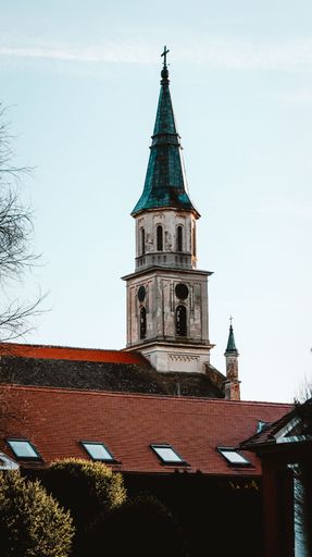 A vertical shot of a historic church tower Ecka village, Vojvodina, Serbia