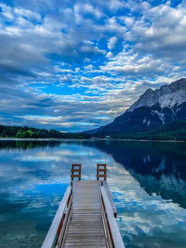 A vertical shot of a beautiful lake in the forest in Bayern, Germany