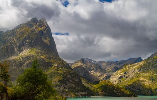 A scenic view of stunning alpine highlands on a cloudy day in Switzerland